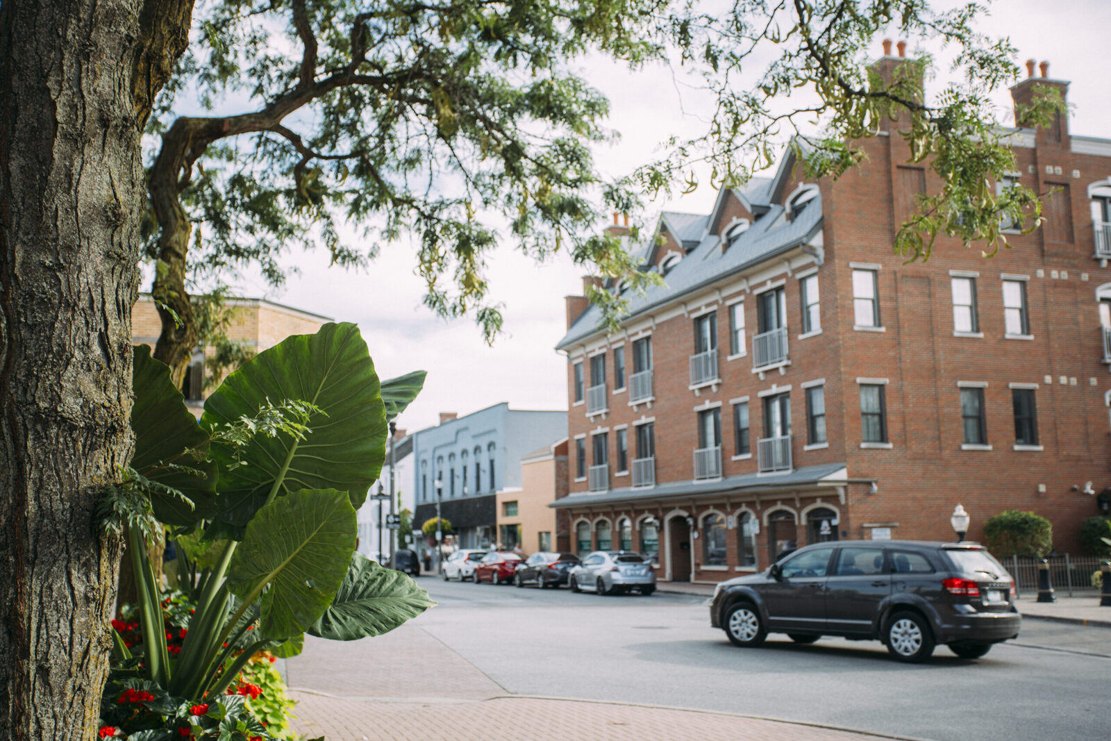Historic downtown Amherstburg street with red-brick heritage buildings and patios