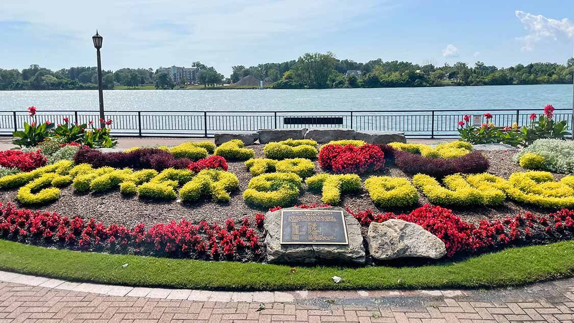 Amherstburg waterfront with the floral town sign along the Detroit River