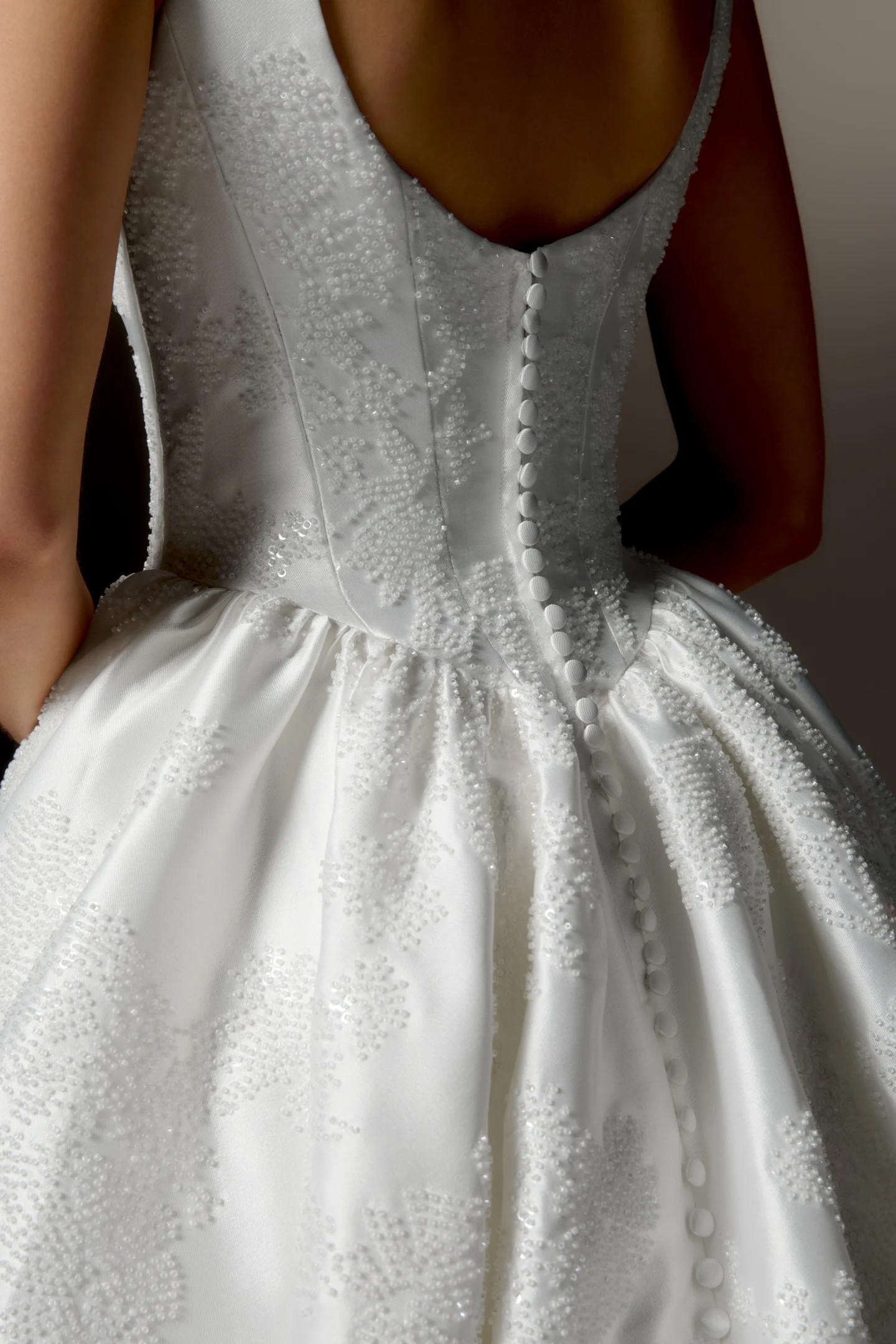Serata — beaded scoop-neck ballgown with a fitted bodice and full skirt