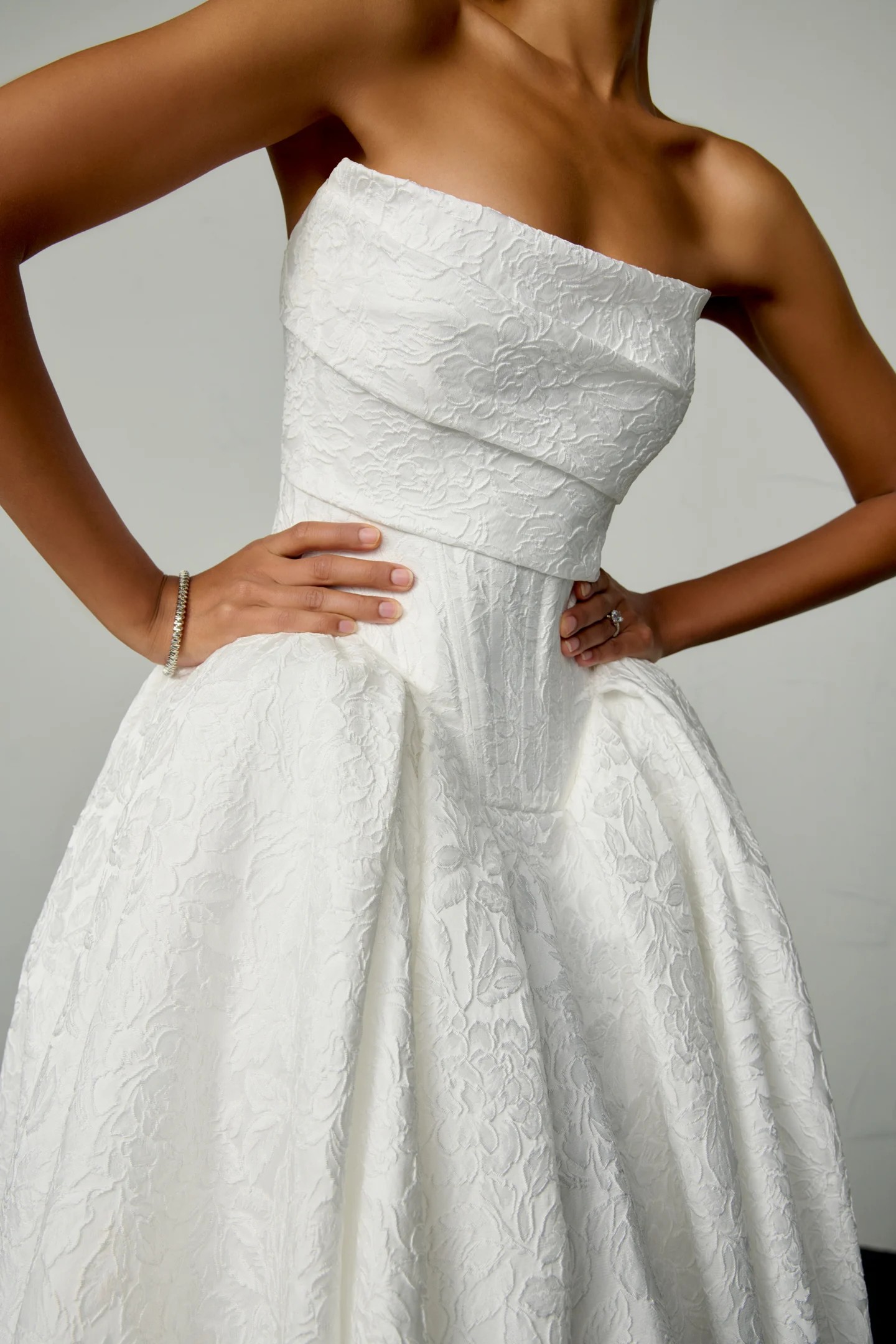Romelle — strapless textured jacquard ballgown with pockets